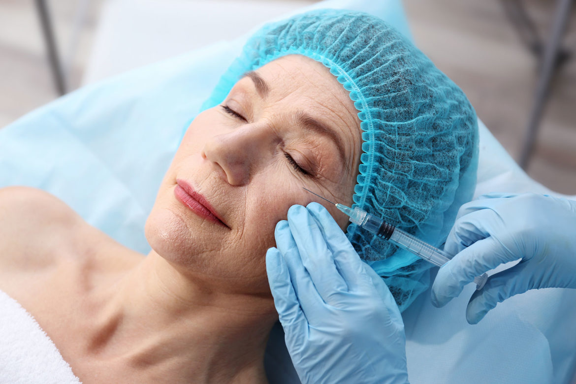 An older woman getting botox injections