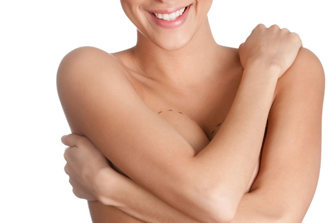 A woman with her arms over her body
